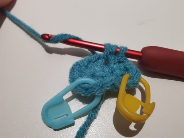 yarn over once more for the next half double stitch in same hole